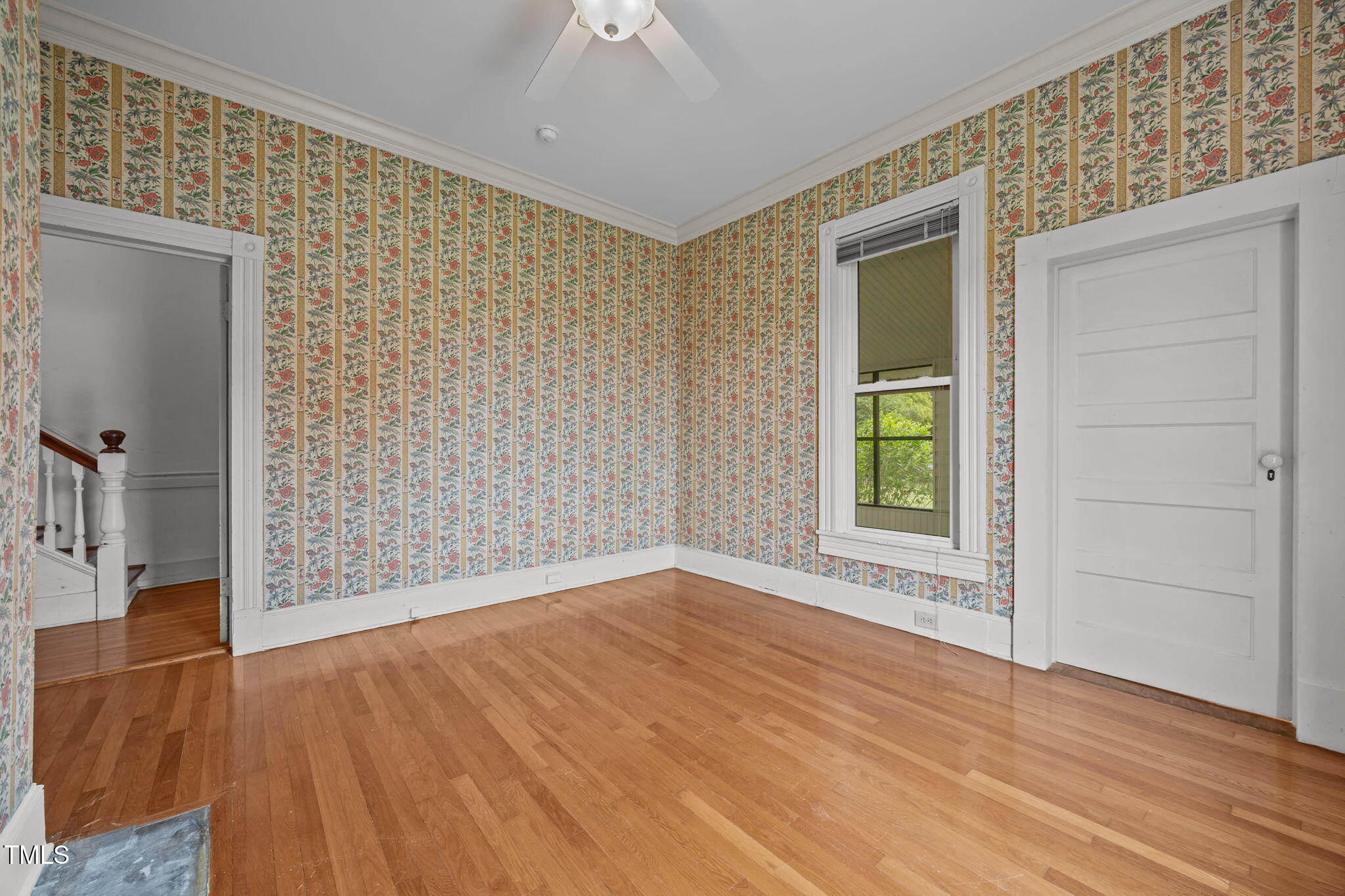 301 East H Street Erwin, NC 28339 - Photo 21 of 56 wooden floor in an empty room with a window