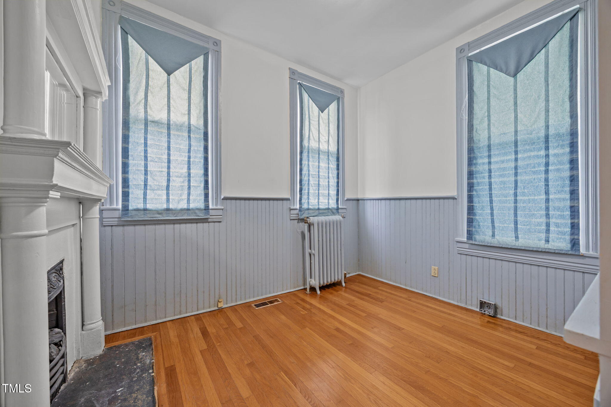 301 East H Street Erwin, NC 28339 - Photo 22 of 56 a bedroom with a bed and a window
