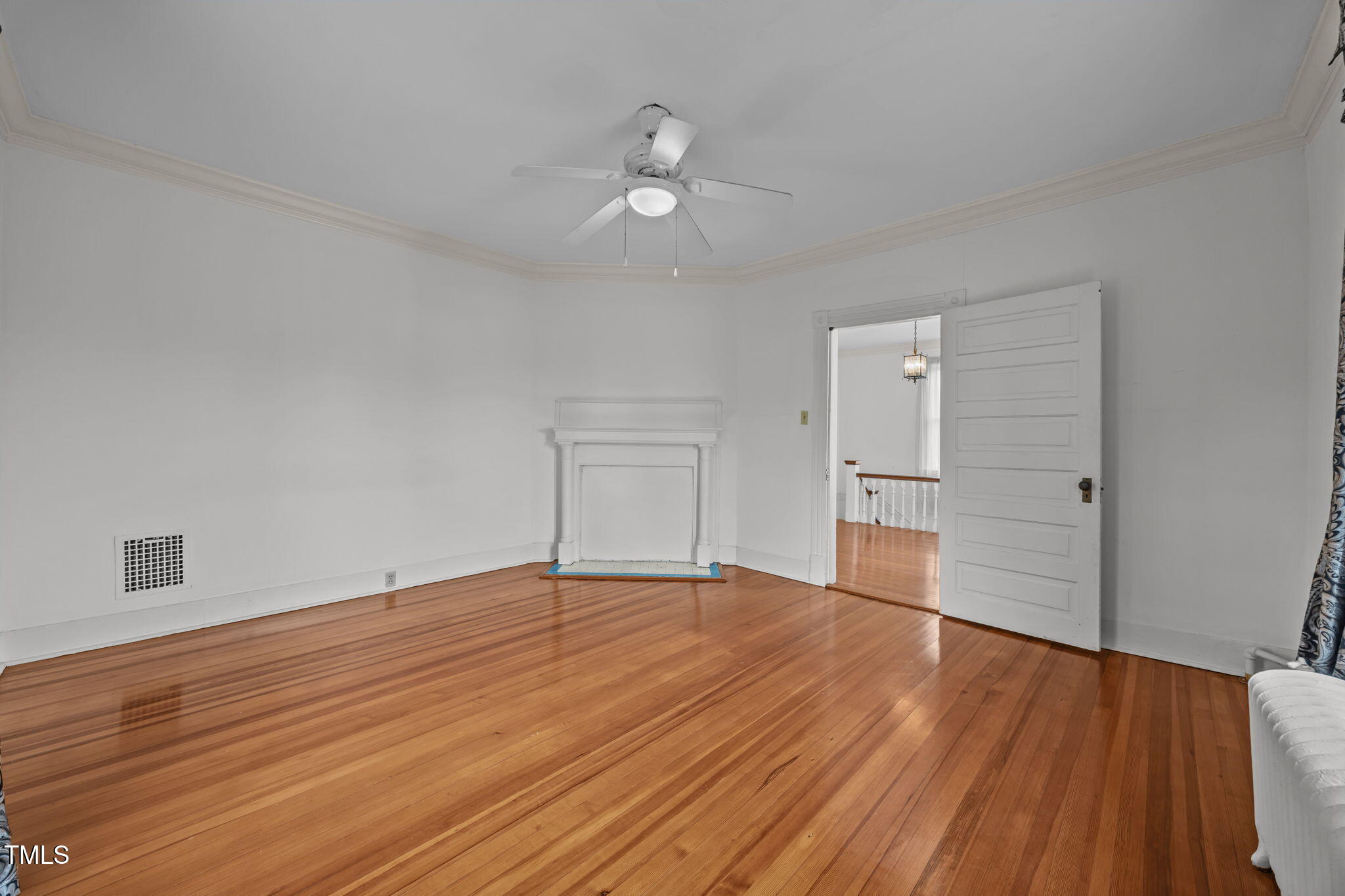 301 East H Street Erwin, NC 28339 - Photo 40 of 58 a view of empty room with wooden floor
