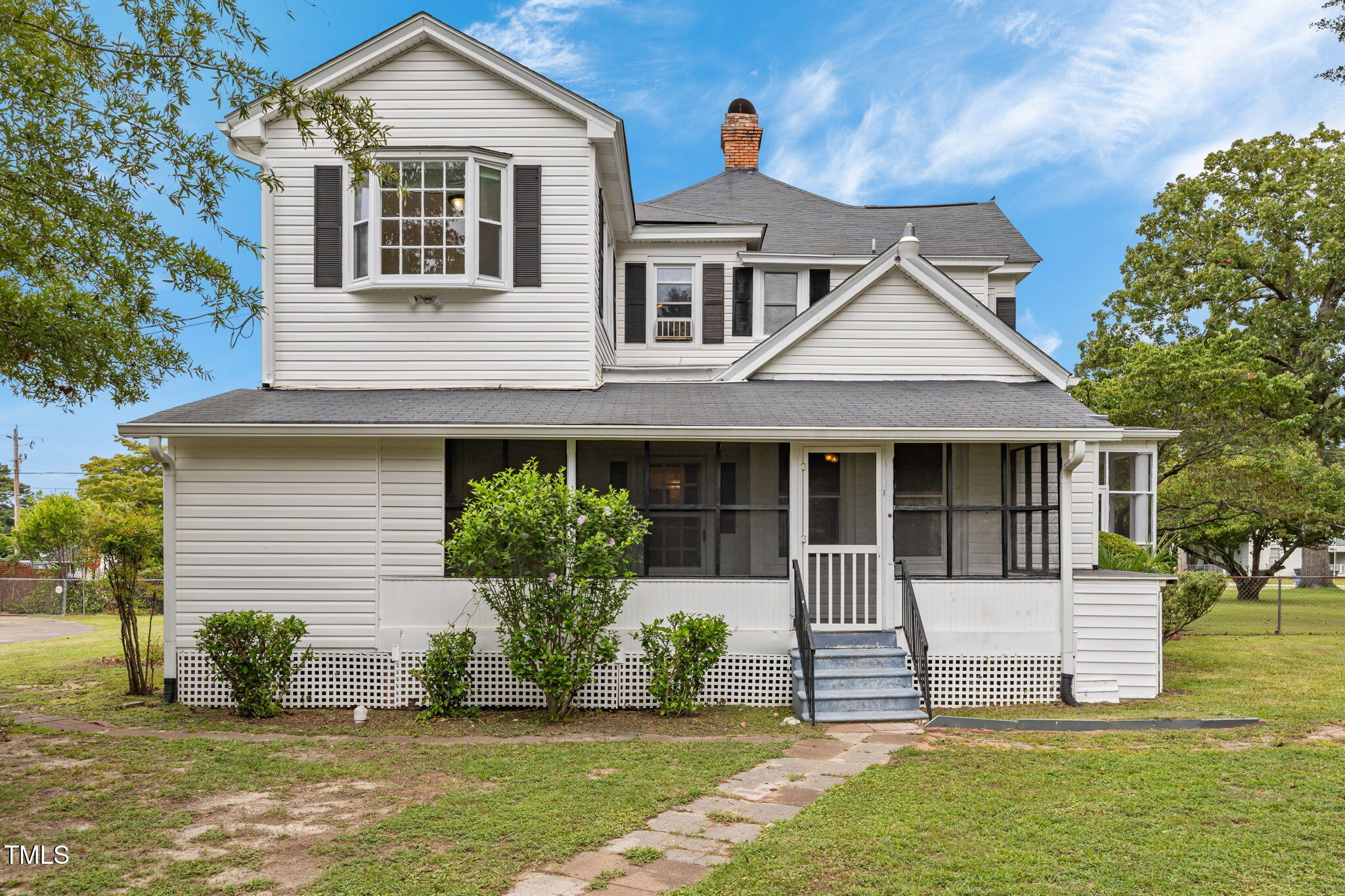 301 East H Street Erwin, NC 28339 - Photo 42 of 56 a front view of a house with a yard