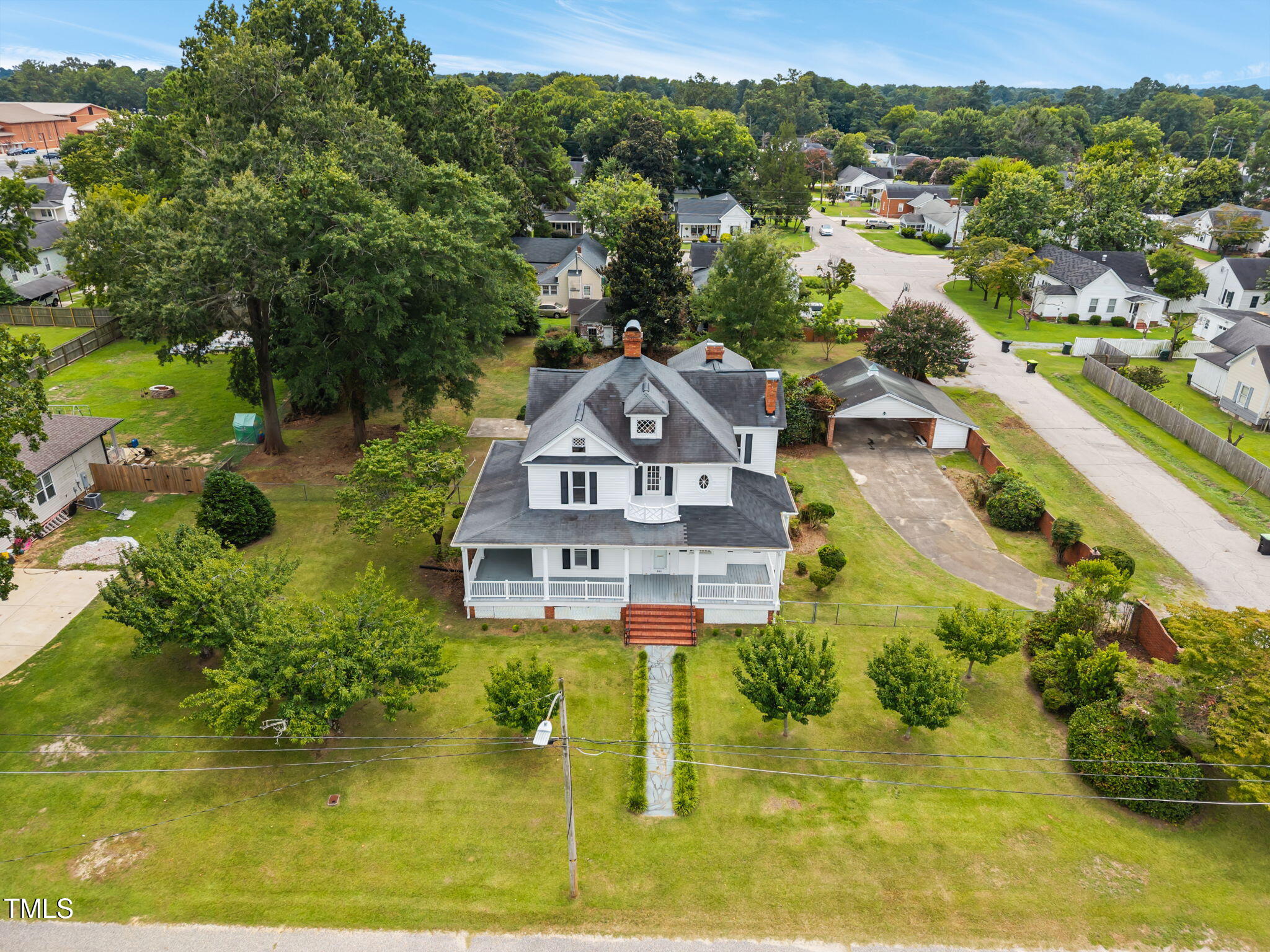 301 East H Street Erwin, NC 28339 - Photo 43 of 56 an aerial view of a house with a garden