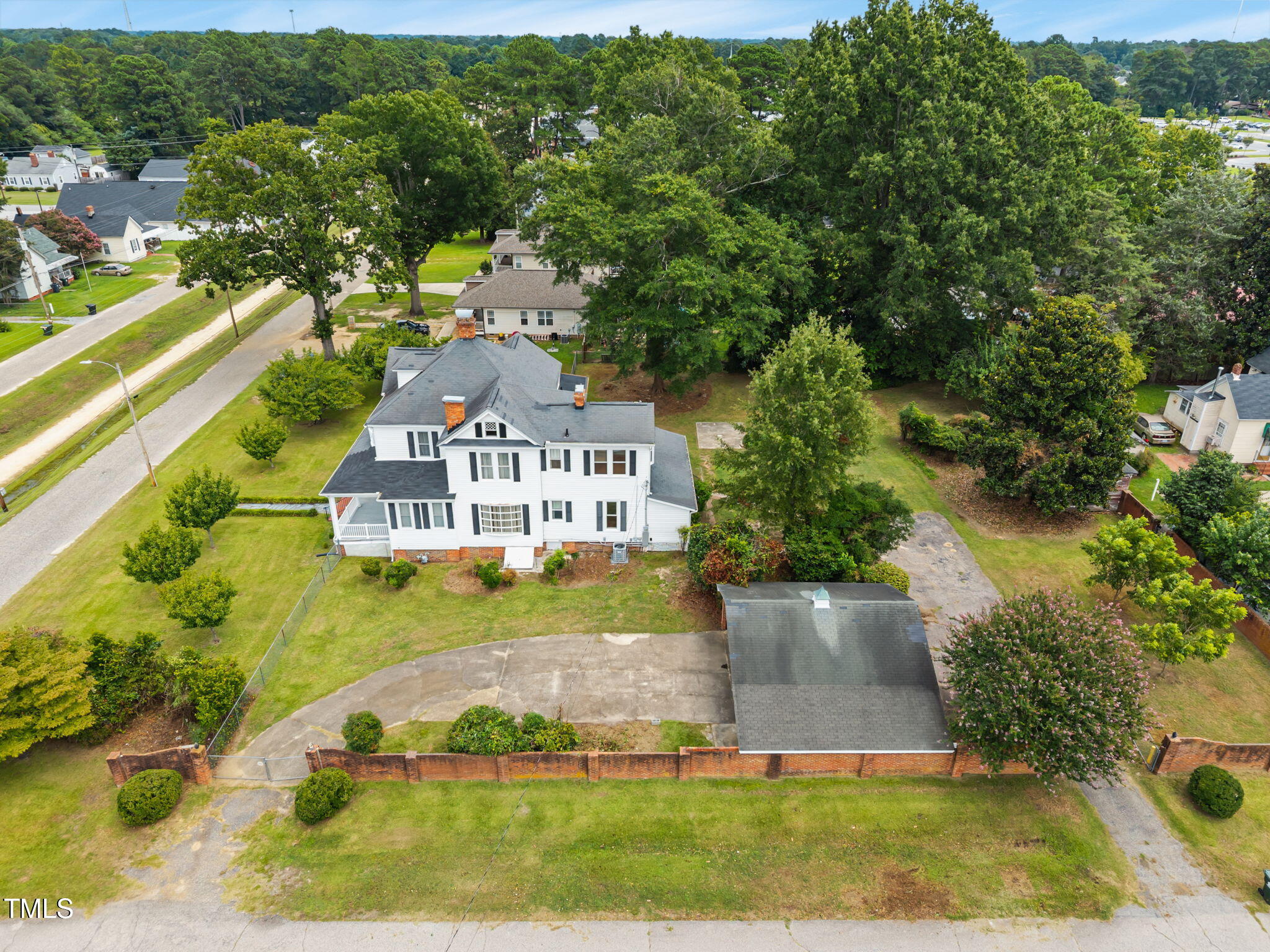 301 East H Street Erwin, NC 28339 - Photo 44 of 56 a view of a swimming pool with a yard