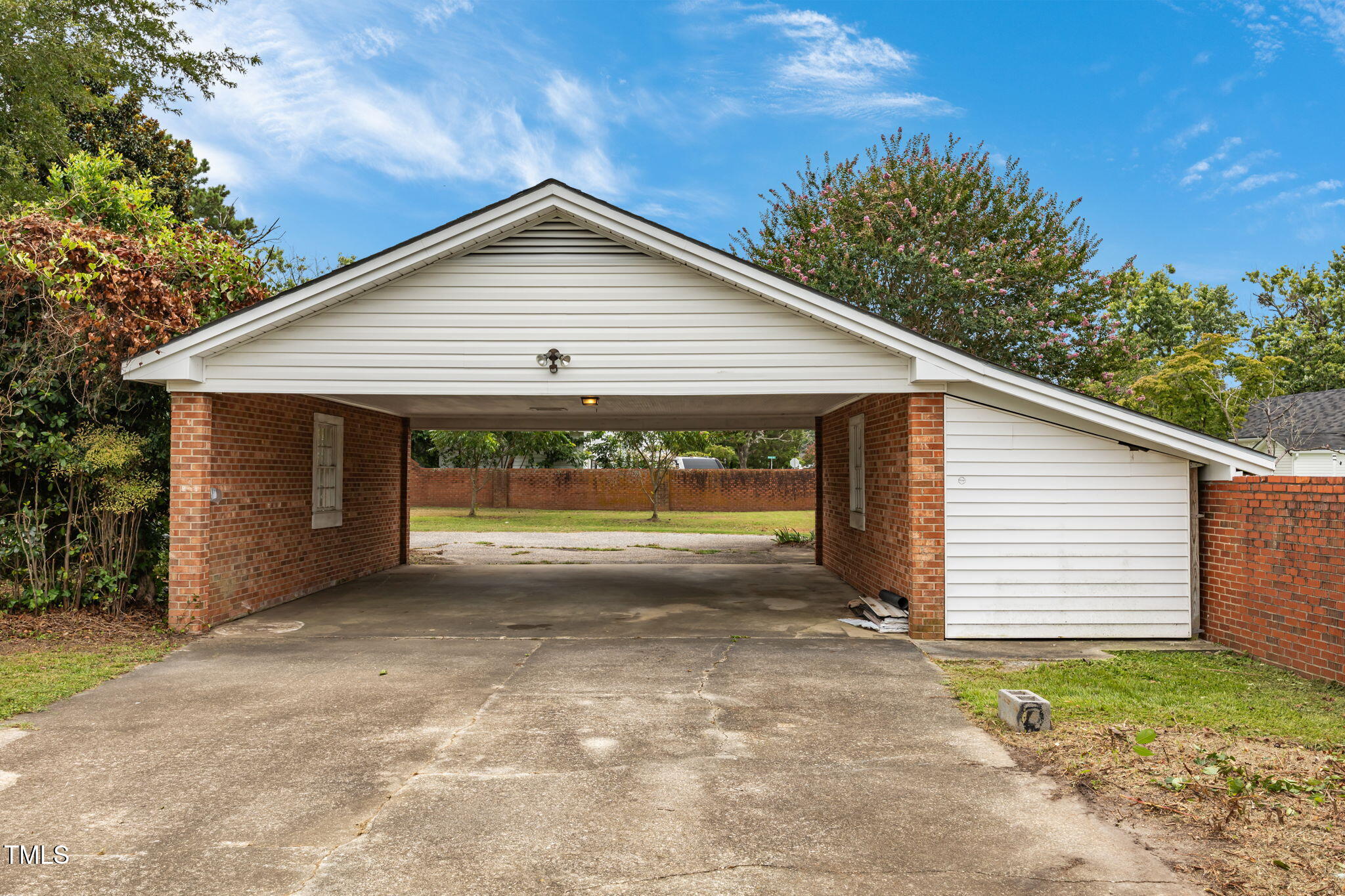 301 East H Street Erwin, NC 28339 - Photo 51 of 58 a view of a house with a yard and garage