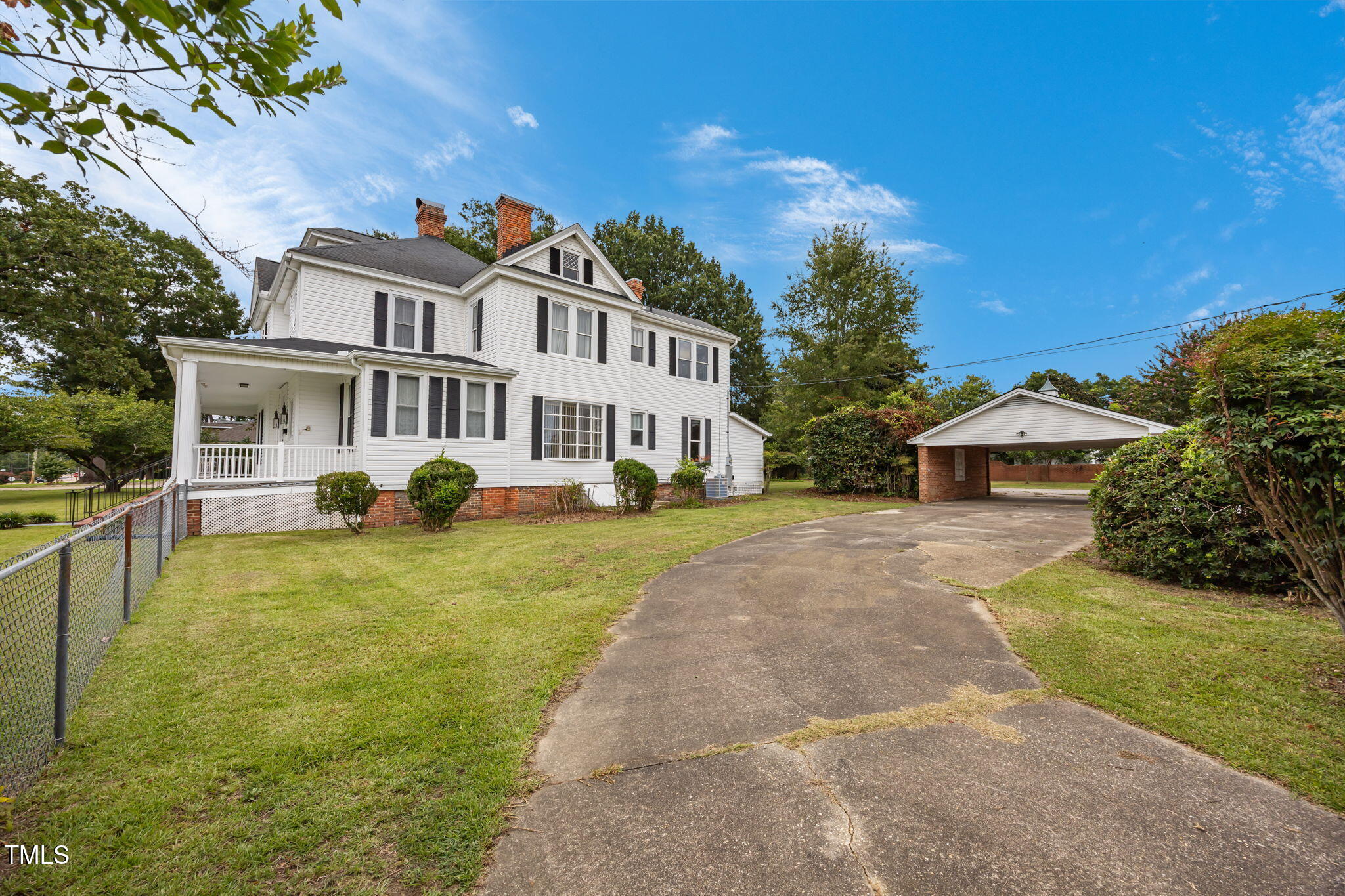 301 East H Street Erwin, NC 28339 - Photo 53 of 58 a front view of a house with garden