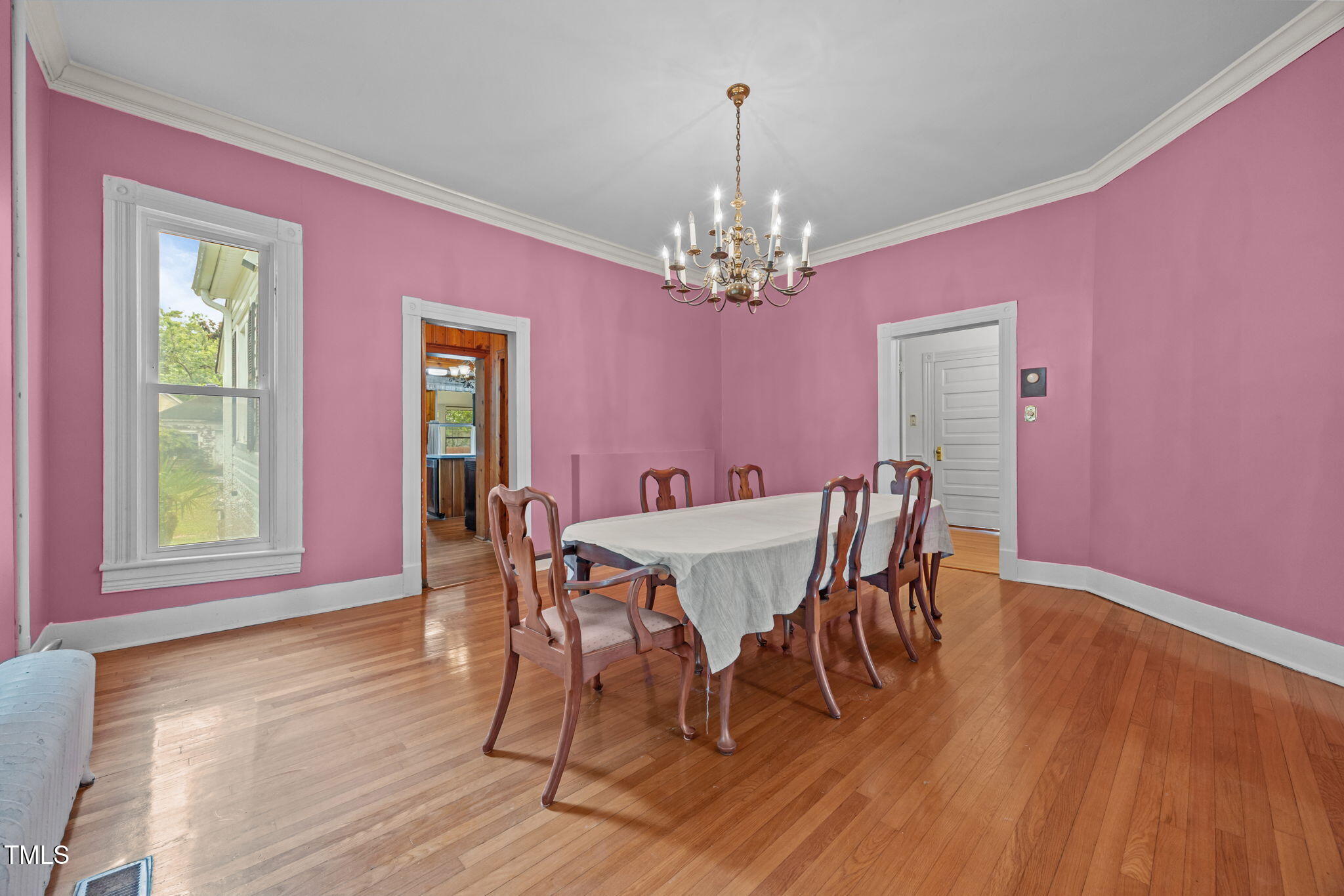 301 East H Street Erwin, NC 28339 - Photo 8 of 56 a view of a dining room with furniture window and wooden floor