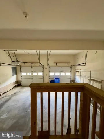 a view of balcony with wooden floor and fence