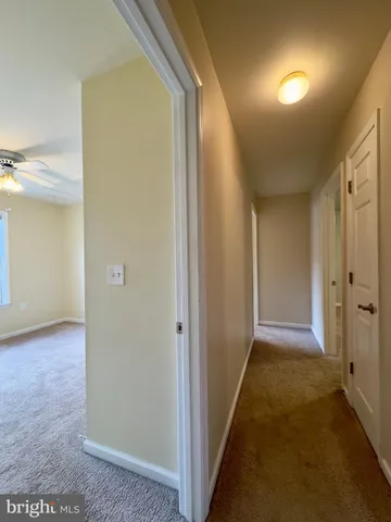 a view of hallway with livingroom