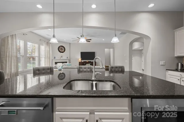 a room with furniture table and a window