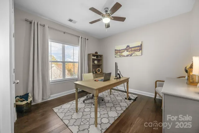 a en suite bathroom with a sink double vanity and a mirror