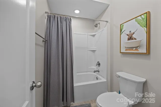 a work room with furniture and a window