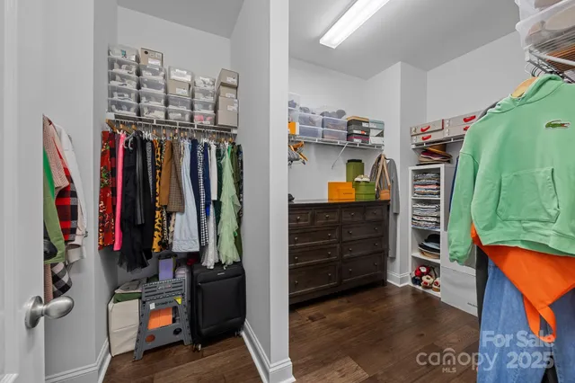 a spacious bathroom with a granite countertop double vanity sink and a mirror