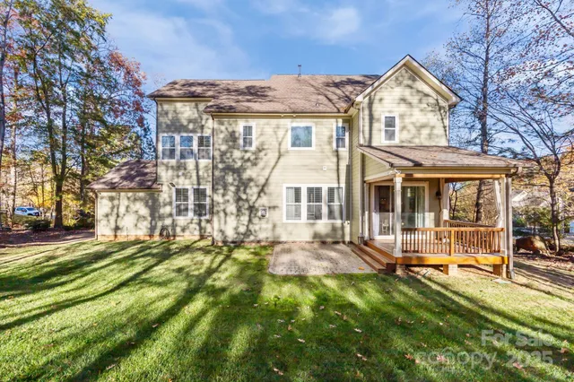 a front view of a house with a garden and porch