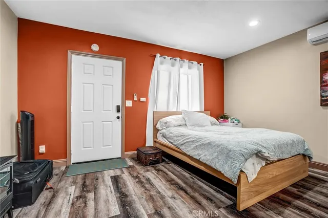 a living room with stainless steel appliances kitchen island granite countertop a kitchen view and living room furniture