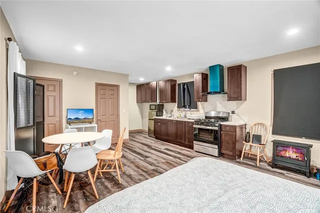 a spacious bedroom with a bed and large windows