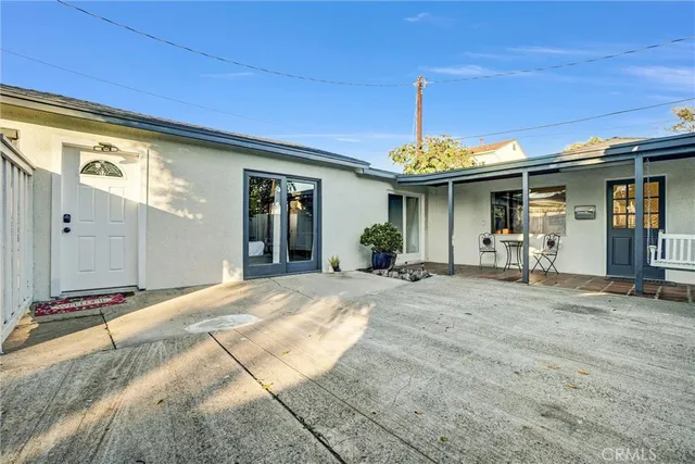 a view of a house with dining room and wooden fence