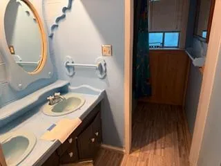 a bathroom with a sink and a mirror