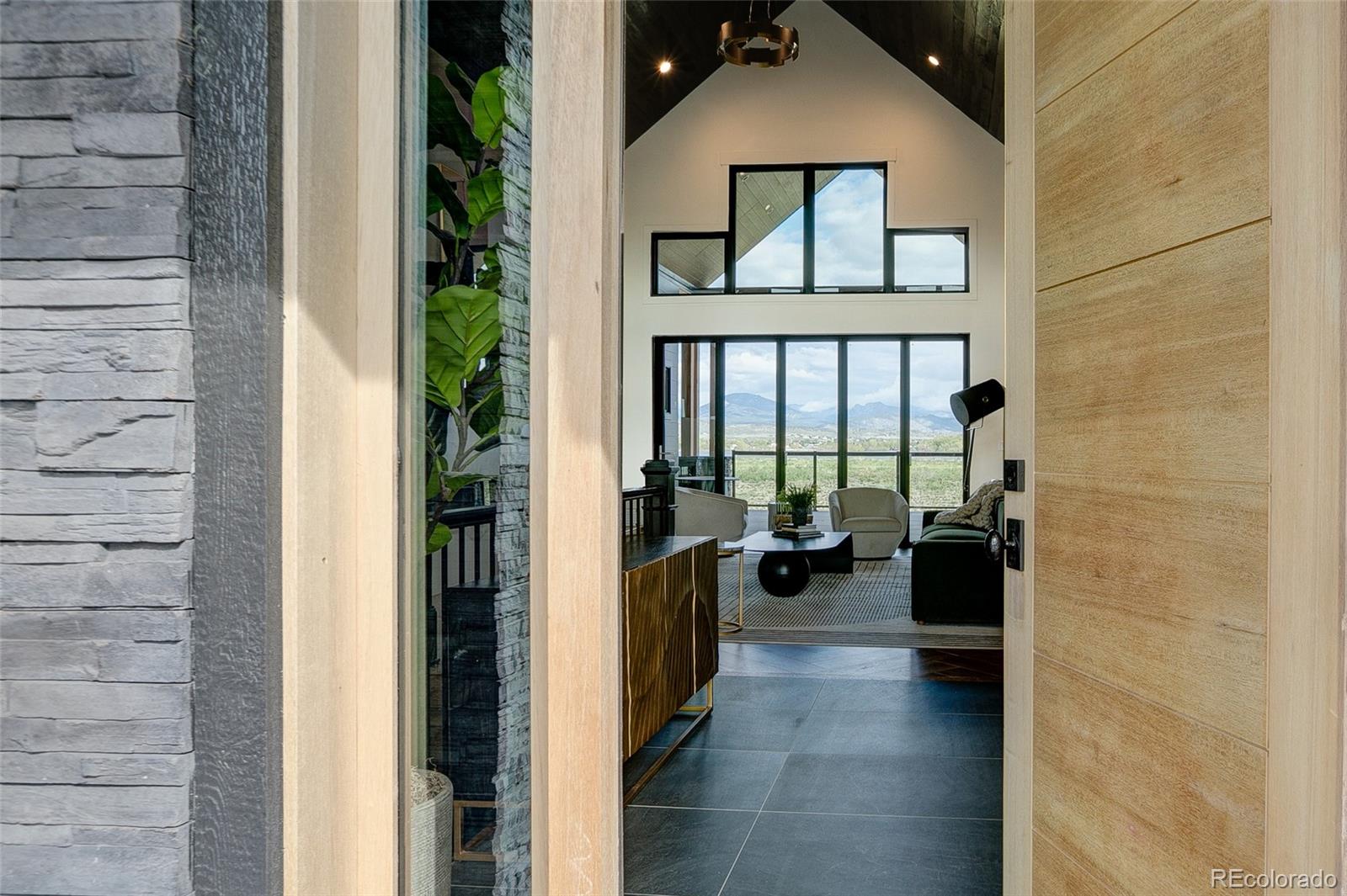 a hallway with a view of living room