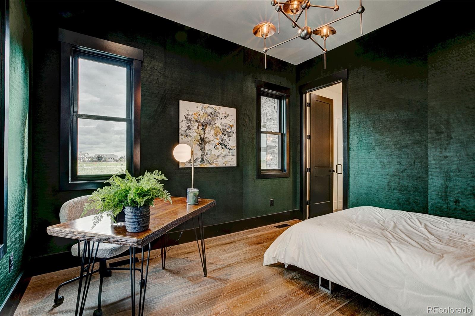 2531 Southwind Road Berthoud, CO 80513 - Photo 12 of 33 a bed sitting in a bedroom next to a window