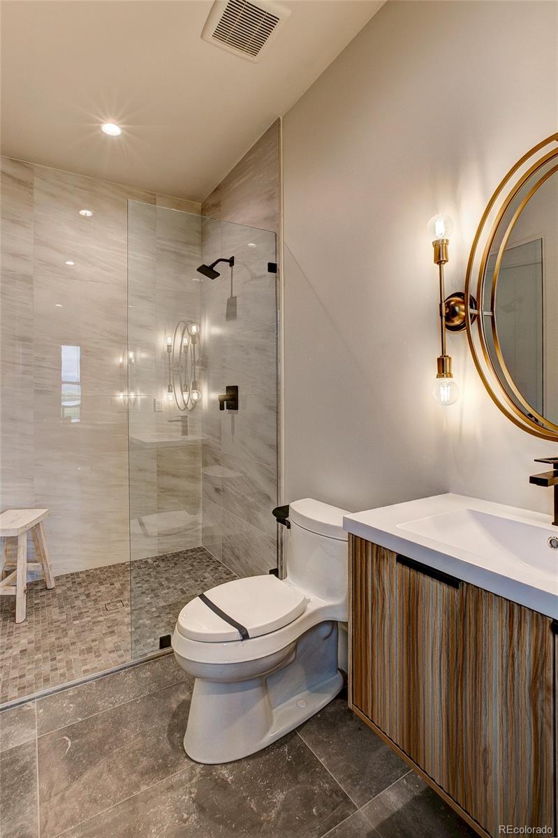 2531 Southwind Road Berthoud, CO 80513 - Photo 13 of 33 a bathroom with a sink a toilet and shower