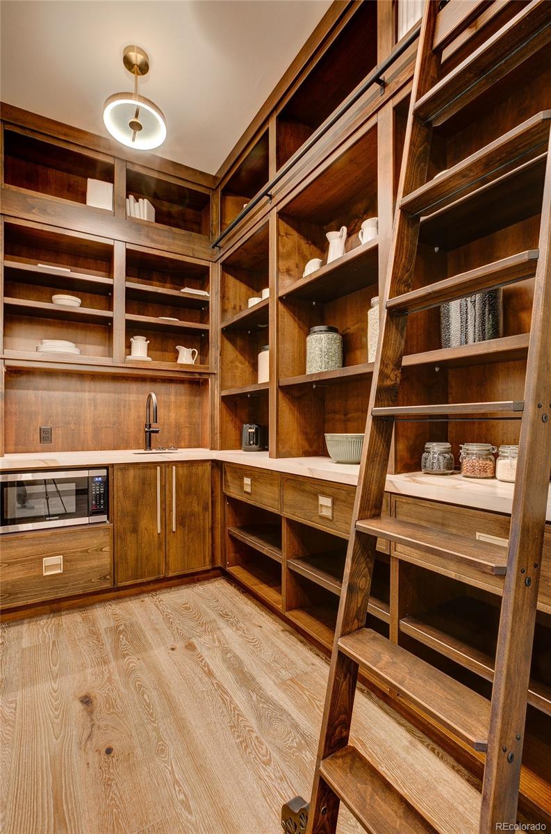 2531 Southwind Road Berthoud, CO 80513 - Photo 14 of 33 a view of walk in closet with empty racks