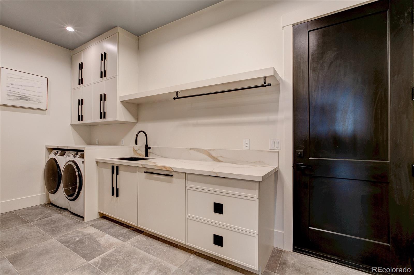 2531 Southwind Road Berthoud, CO 80513 - Photo 15 of 33 a kitchen with stainless steel appliances granite countertop a refrigerator and a sink