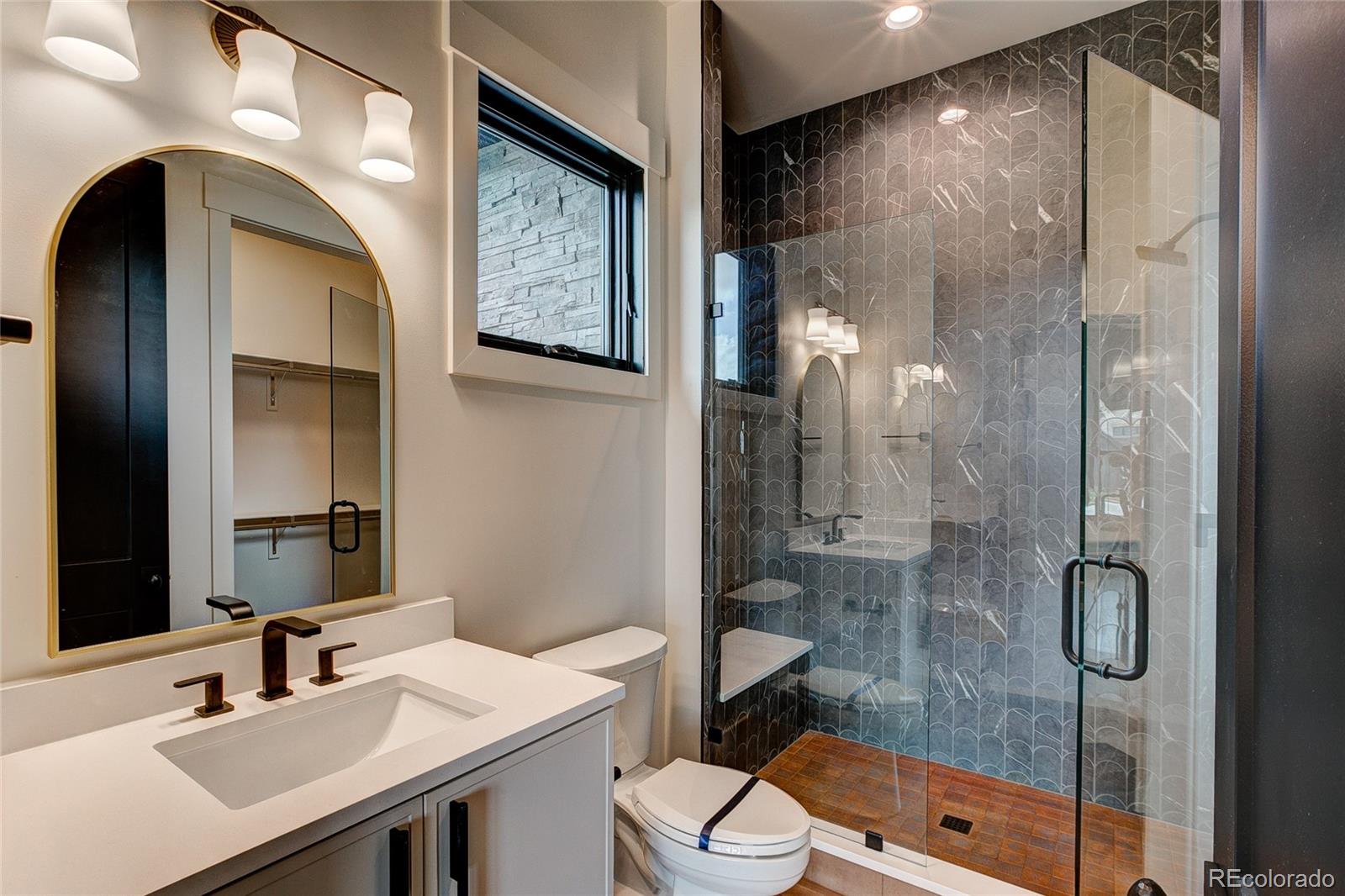 2531 Southwind Road Berthoud, CO 80513 - Photo 18 of 33 a bathroom with a sink toilet and shower