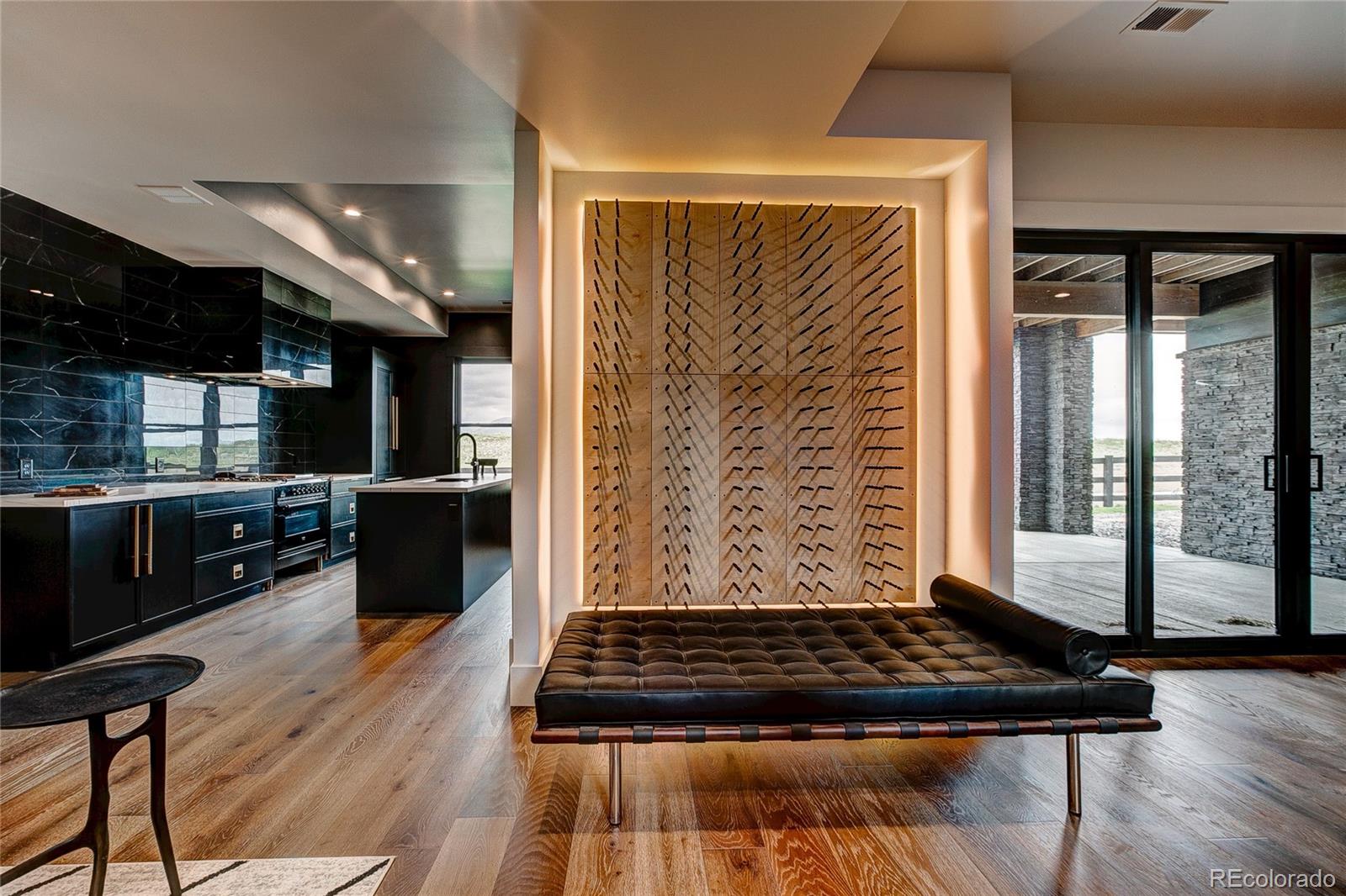 2531 Southwind Road Berthoud, CO 80513 - Photo 25 of 33 a kitchen with wooden floors and a black appliances
