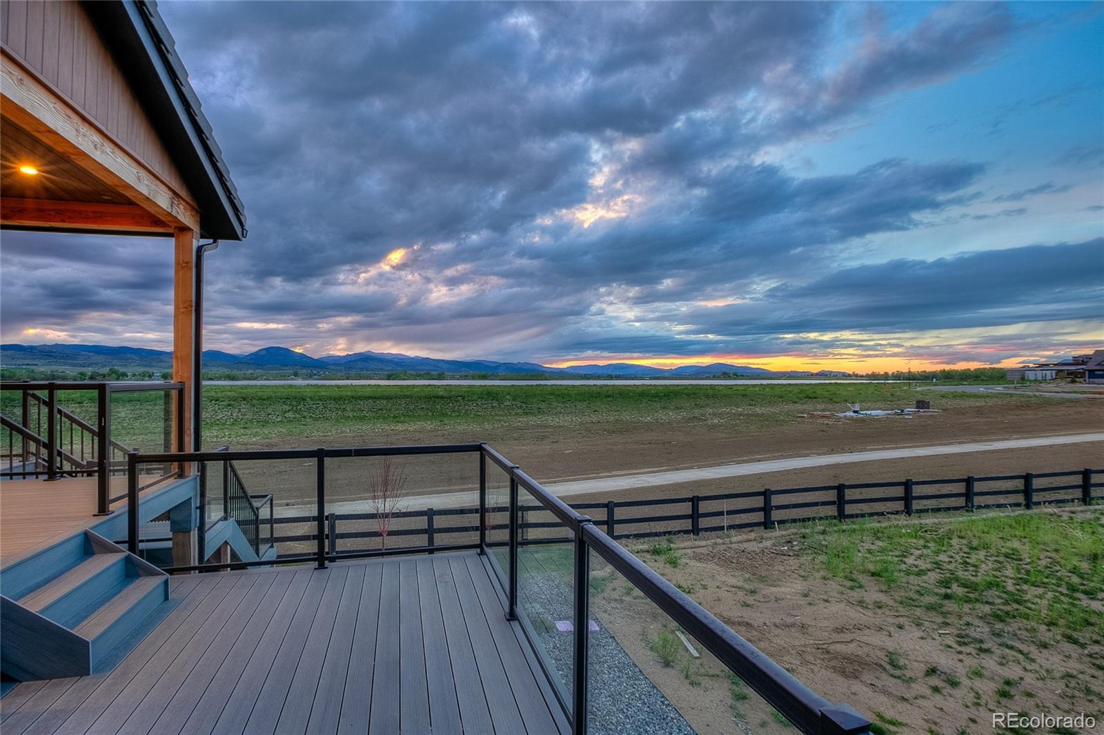 2531 Southwind Road Berthoud, CO 80513 - Photo 33 of 33 a view of a balcony with wooden floor and fence