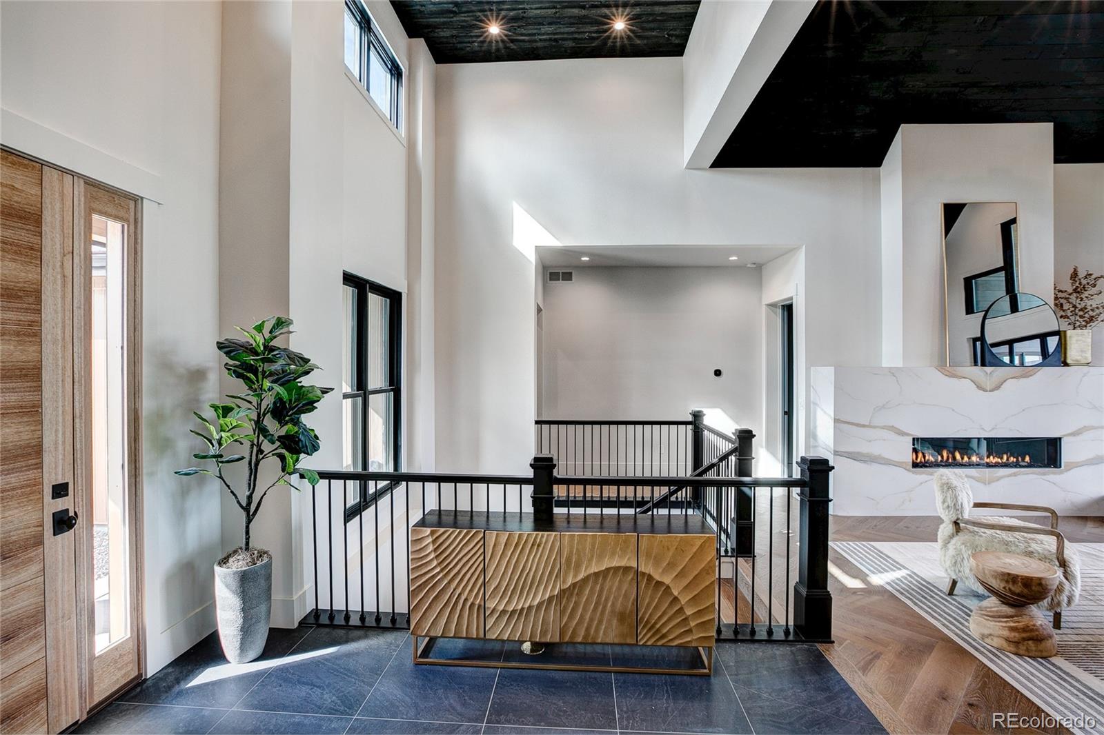 2531 Southwind Road Berthoud, CO 80513 - Photo 4 of 33 a view of front door with chair and wooden floor