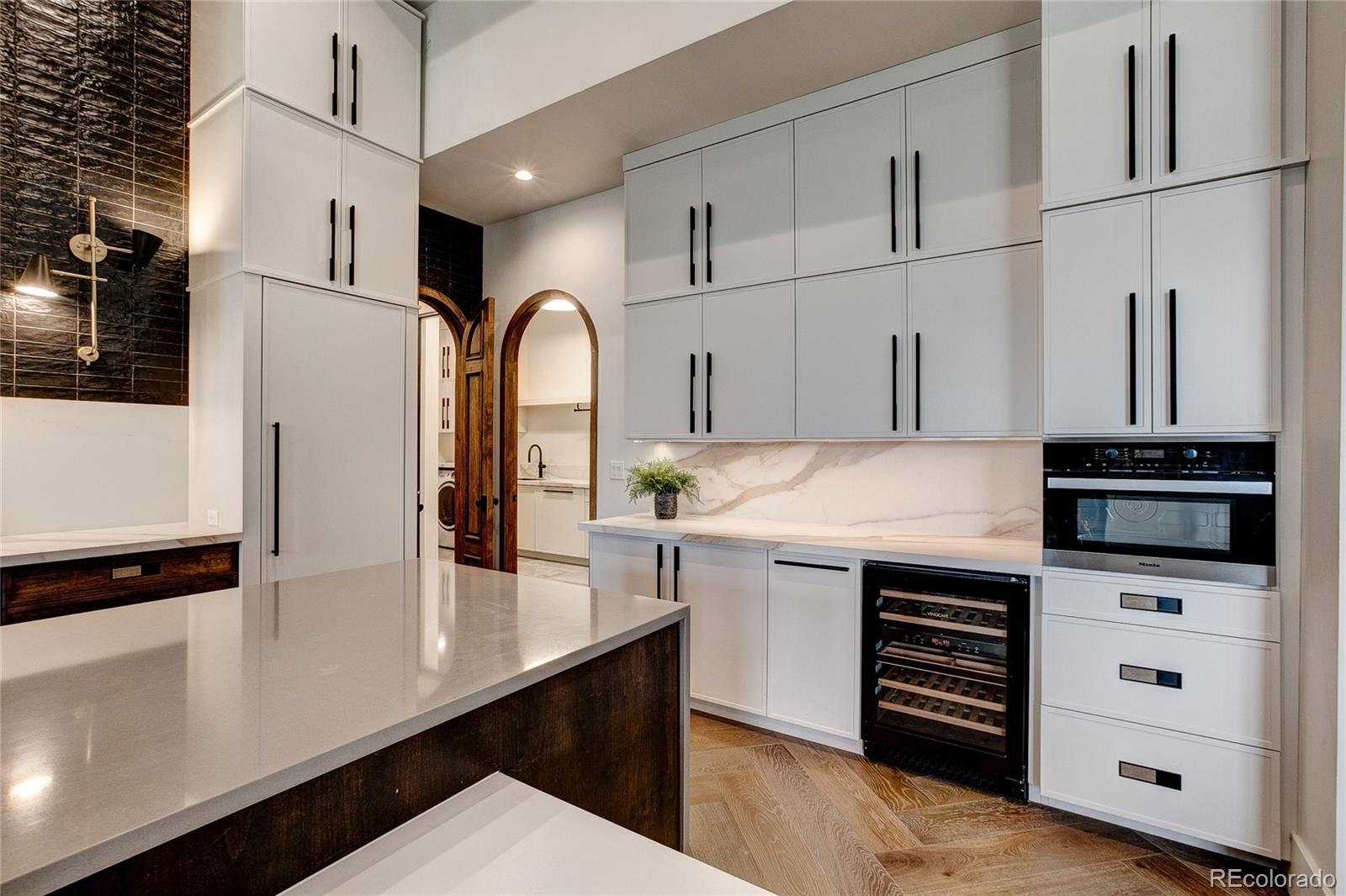 2531 Southwind Road Berthoud, CO 80513 - Photo 6 of 33 a kitchen with stainless steel appliances a sink a stove and refrigerator