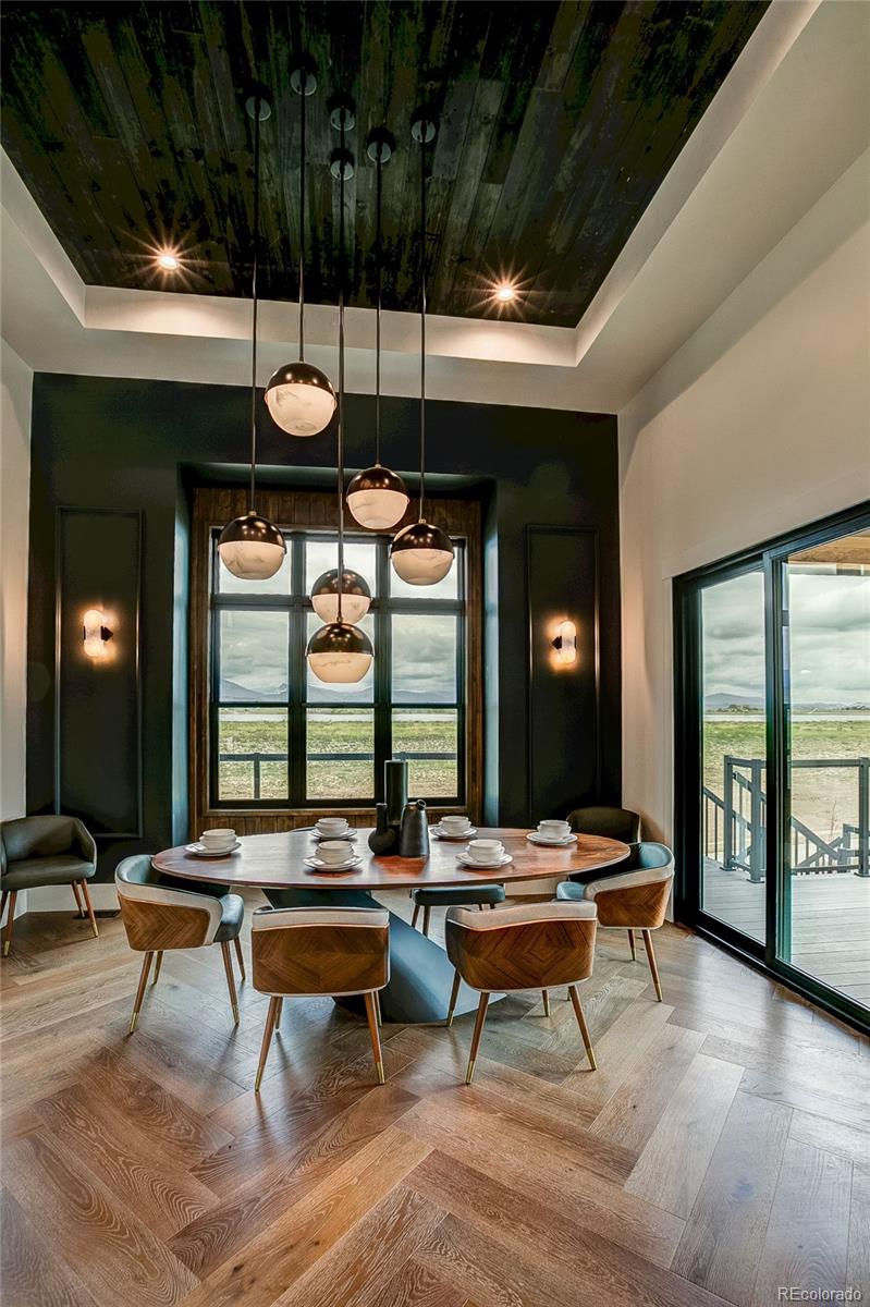 2531 Southwind Road Berthoud, CO 80513 - Photo 10 of 33 a living room with furniture a rug and a large window