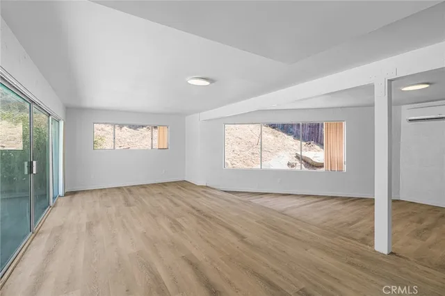 a view of an empty room and window