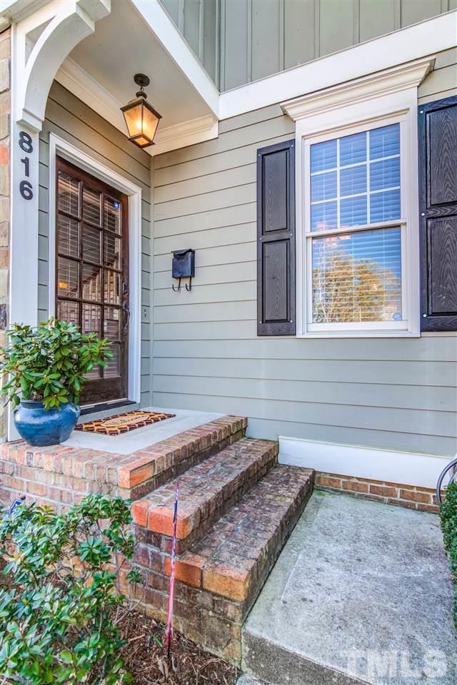 816 Cotton Exchange Court Raleigh, NC 27608 - Photo 2 of 25 a front view of a house with a yard