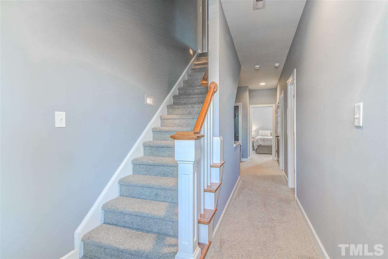 816 Cotton Exchange Court Raleigh, NC 27608 - Photo 18 of 25 a view of entryway and hall with wooden floor