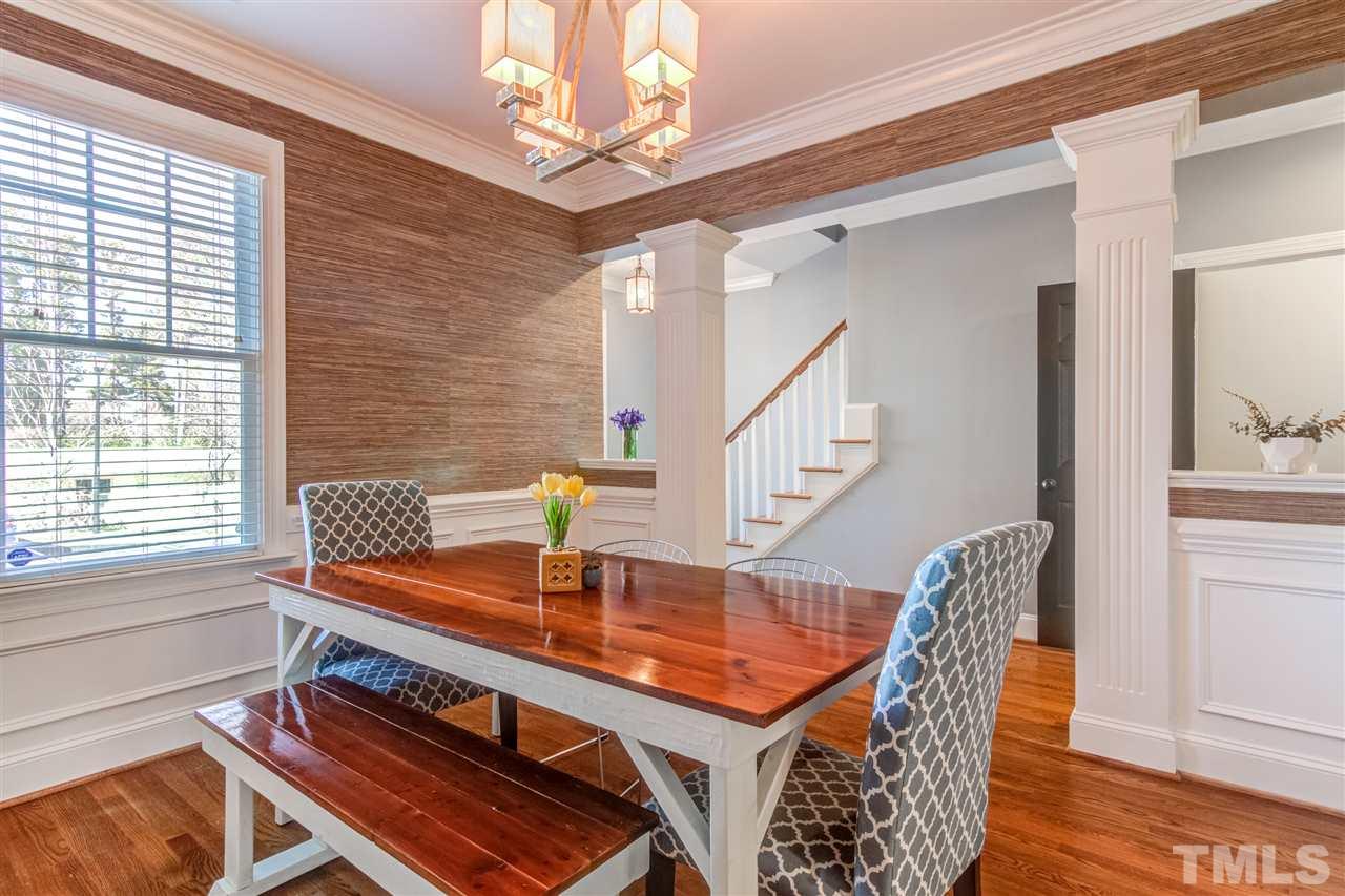 816 Cotton Exchange Court Raleigh, NC 27608 - Photo 5 of 25 a view of a dining room with furniture and wooden floor