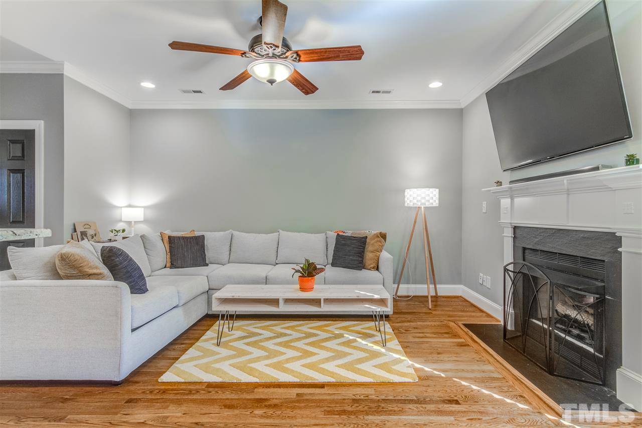 816 Cotton Exchange Court Raleigh, NC 27608 - Photo 10 of 25 a living room with furniture fireplace and flat screen tv
