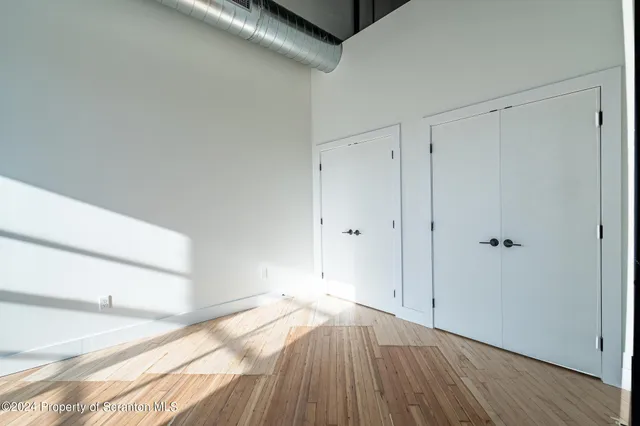 a view of a livingroom with wooden floor