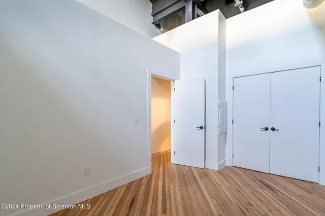 a kitchen with a stove a sink and a microwave