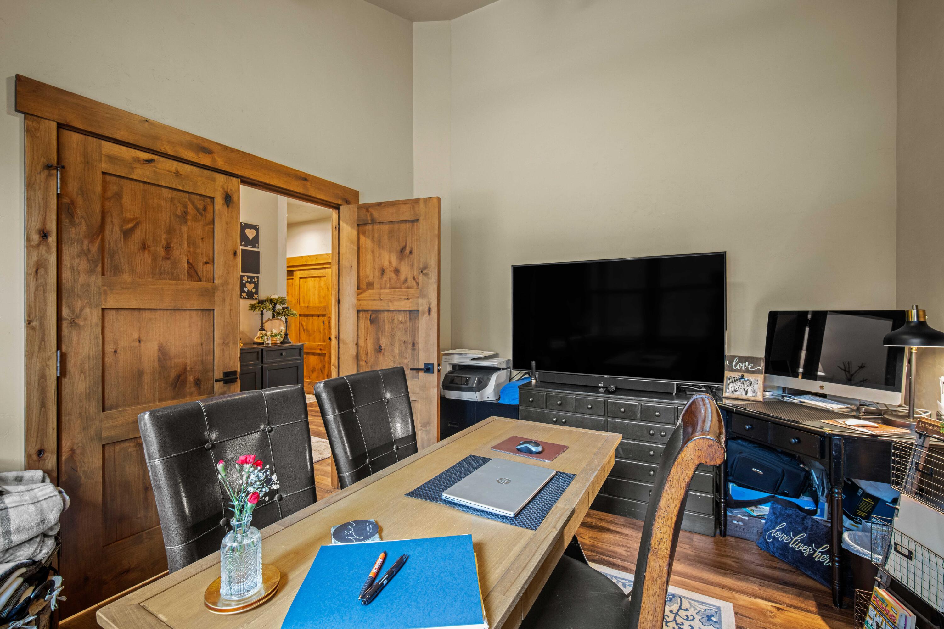 16927 Covina Road Bend, OR 97707 - Photo 15 of 54 Flexible den or office at the front of this Bend, Oregon home, filled with natural light and well positioned for a home workspace, sitting room, or overflow sleeping area.