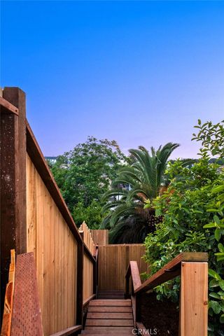 a backyard of a house with barbeque oven and outdoor seating