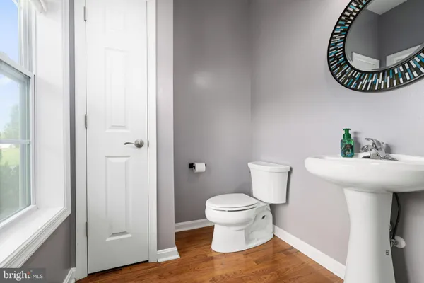 a bathroom with a toilet and a sink