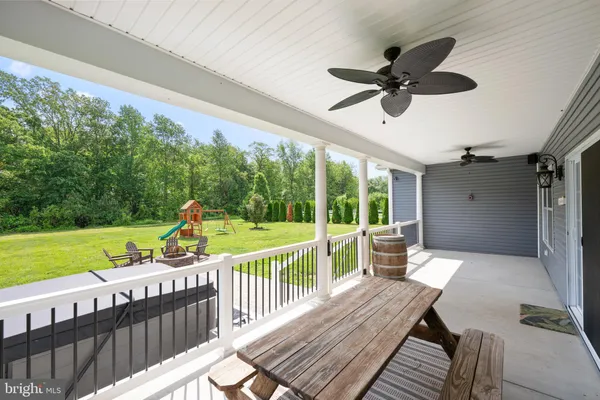 a view of a deck with a table and chairs