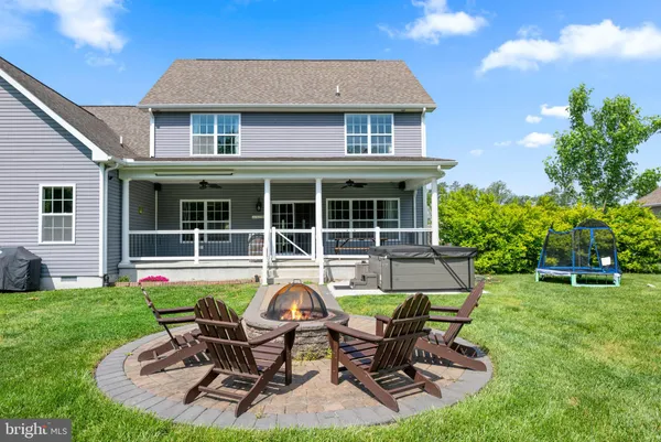 a house view with a seating space and garden