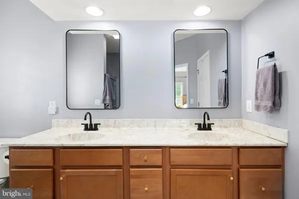 a bathroom with a glass shower door