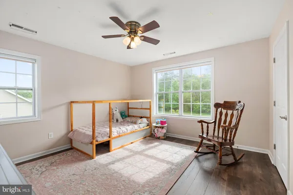 a bedroom with furniture and a window