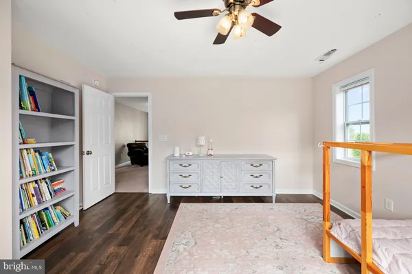 a room with gym equipment and windows