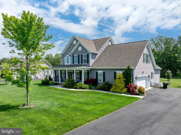 an aerial view of a houses with outdoor space and street view