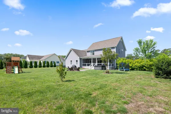 an aerial view of multiple houses with yard