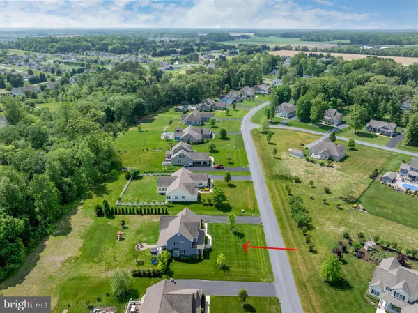 an aerial view of a residential houses with city view