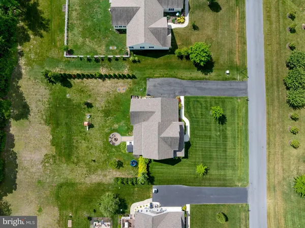 a front view of a house with a yard table and chairs